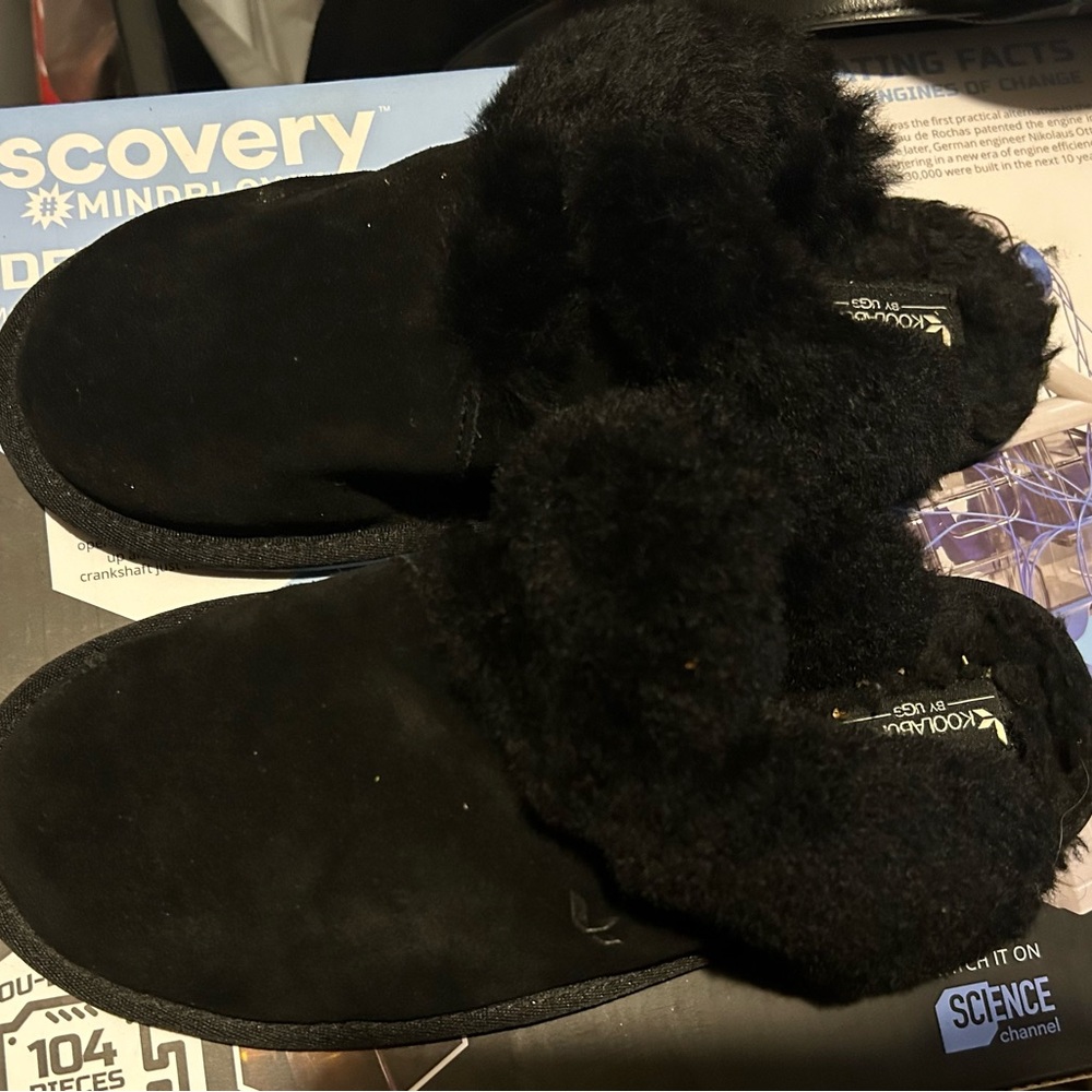 Woman’s black kookaburra Ugg slippers